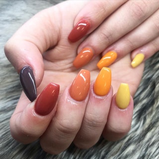 Hands with a multicolor manicure