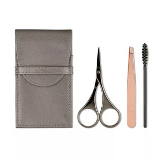 Japonseque Luxe Brow Kit products  mini scissors tweezers and mascara wands on white background