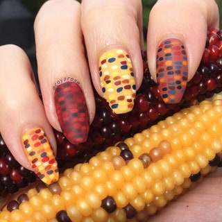 A manicure painted to look like corn